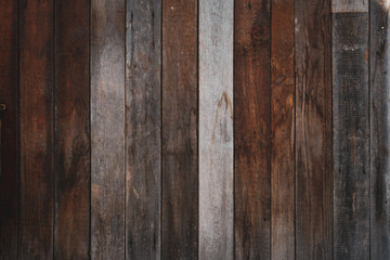 Obraz premium Background of vertical aged boards of dark gray color and the same size