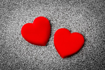 Obraz premium Valentines day red heart on a gray silver background. Holidays card with copy space.