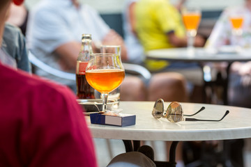 Tourists drinks beer in street cafe, Europe