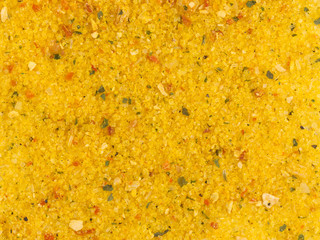 Curry powder spice as a background, natural seasoning texture. Texture of curry powder close-up, spice or seasoning as background