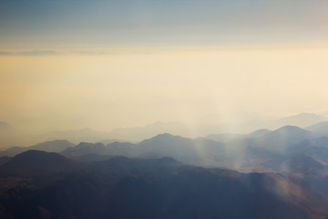 Fototapeta na wymiar Landscape of Mountain. view from airplane window