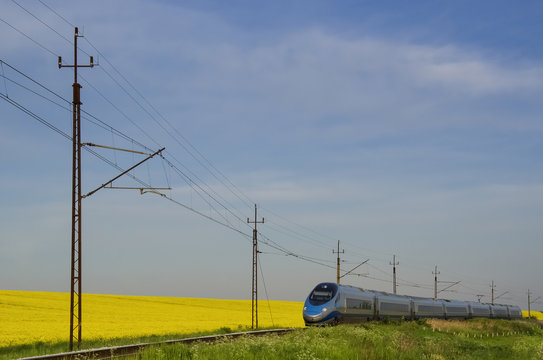 WEST POMERANIAN / POLAND - 2016: Express train on the route of the spring fields