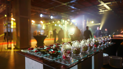 Beautifully decorated catering banquet table with different food snacks.