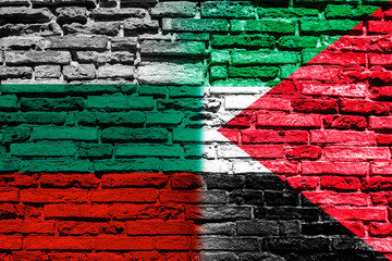Flag of Palestine and Bulgaria on brick wall
