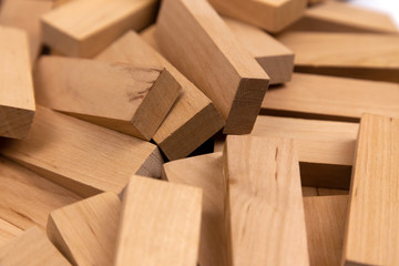 The texture of a pile of wooden blocks that lie randomly. Background.