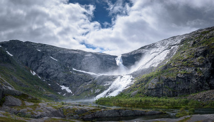 Sotefossen waterfall raging down in Husedalen mountain valley Norway panorama