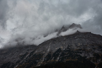 The Eiger peak among the clouds, seen from Grindelwald in the Bernese Oberland region. Switzerland