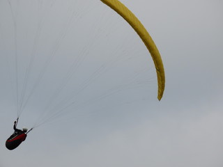 paraglider flight in cloudy day