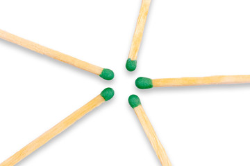 Wooden matches laid out in the shape of a star on white background