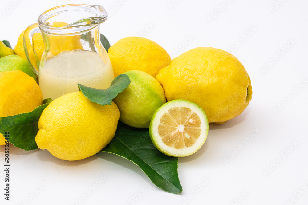 Wall mural lemon juice with natural lemons on white background - Wall murals