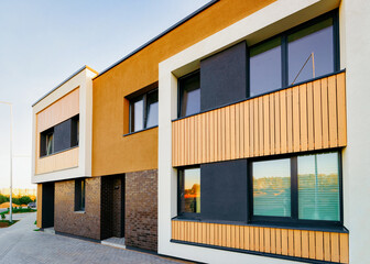 Apartment residential townhouses facade architecture and outdoor facilities. Blue sky on the background.