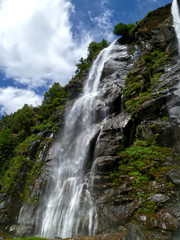 Fototapeta na wymiar Italian waterfall with grass vegetation