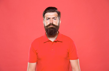 Hiring barber. Barber career. Barber salon. Man bearded hipster with long beard and mustache on red background. Hairstyle is kind of art. Well groomed hipster. Barbershop concept. Facial hair care