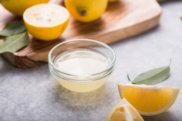 Lemon fresh and lemons. Citrus juice extractor. The concept of weight loss . Citrus juicer and squeezed fruits