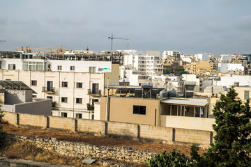 Obraz premium Sliema Malta, July 16 2019. Traditional Maltese architecture in Sliema Old Town in Malta, street with traditional balconies and old buildings in historical city of Malta.