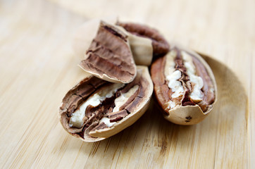 pecan close-up macro high resolution on wooden background