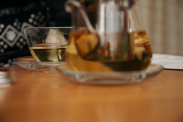 Process brewing tea,tea ceremony,Cup of freshly brewed black tea,warm soft light