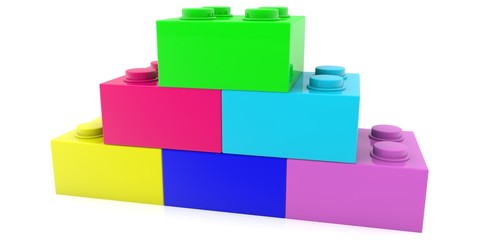 Toy bricks of different colors on a white background in the form of a pyramid