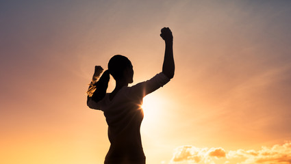 Young strong confident woman flexing, and feeling determined. 