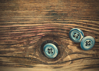 vintage buttons on the aged textured boards