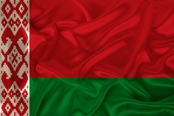 beautiful photo of a colored national flag of the modern state of Belarus on a textured fabric, concept of tourism, emigration, economy and politics, closeup