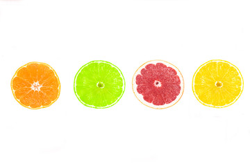Set of citrus fruits slices: yellow juicy lemon, ripe orange, red fresh grapefruit, green lime. Clipping path. Colorful pieces isolated on white background. Healthy vegan, vegetarian food. Vitamin C.