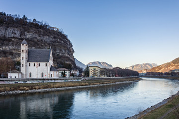 Fototapeta na wymiar Beautiful scenery of Trento city with Saint Apollinare church at Adige river