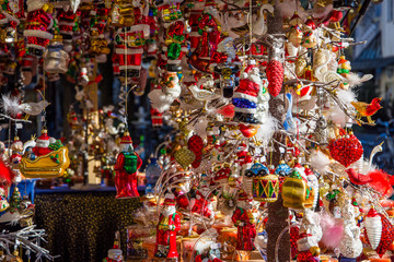 Colored decorations in a stall of the Christmas market in Merano. Trentino Alto Adige - obrazy, fototapety, plakaty