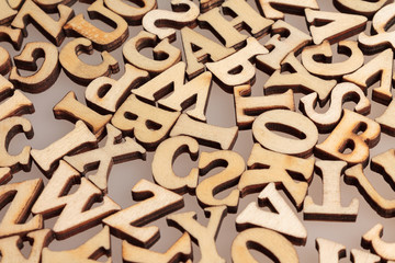 wooden letters of the English alphabet workpiece closeup macro