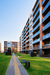 Apartments residential home facade architecture and outdoor facilities. Blue sky on the background.