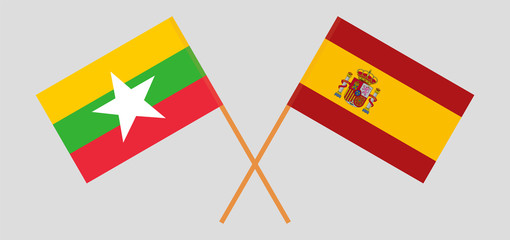 Crossed flags of Myanmar and Spain