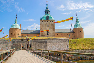 Fototapeta premium The main attraction of the city is the medieval stone Kalmar Fortress with tourists. In the province of Smaland in Sweden. one of Sweden's best preserved renaissance castles