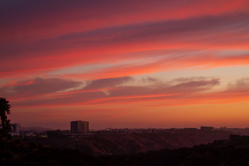 Sunset view of San Diego, California and red cloudy sky