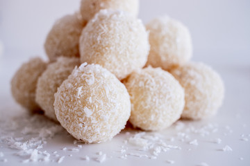Fototapeta na wymiar Fresh baked homemade coconut balls, traditional Czech Christmas sweets