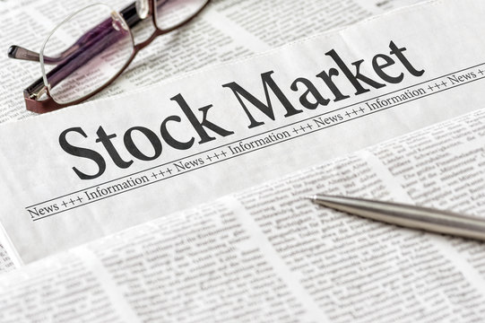 A newspaper with the headline Stock Market
