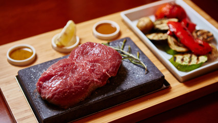 meat grilled on astone with vegetables