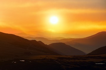 Beautiful sunrise in a mountains . bright sunset