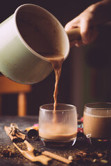 Masala tea ( Masala chai). A traditional hot drink in India and South Asia. Black tea with milk and...
