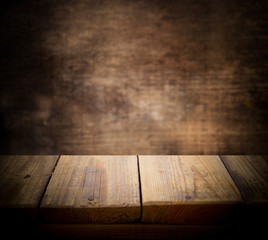 Image of a wooden table in front of abstract blurred background. Place for text. antique countertop.