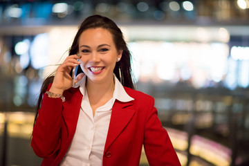 Woman talking on her mobile phone at night