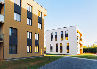 Fototapeta na wymiar Residential Apartment house and home facade architecture with outdoor facilities. Blue sky on the background.