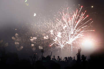 Crowd and fireworks. Celebrations and New Years Eve concept. 