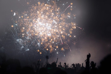 Crowd and fireworks. Celebrations and New Years Eve concept. 