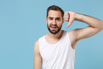 Close up bearded young man 20s years old perfect skin wearing white shirt isolated on blue pastel wall background, studio portrait. Skin care healthcare cosmetic procedures concept. Mock up copy space