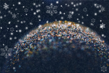 Abstract background of glitter globe with bokeh. Macro shot with shallow focus of a Christmas globe.