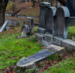 fallen gravestones in cemetery