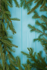 Frame from fresh green spruce branches. Fir twigs and copy space. Winter holiday card.