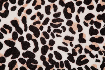 Leopard pattern on textile. Background, top view.
