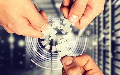 Human hands joining puzzle parts on background