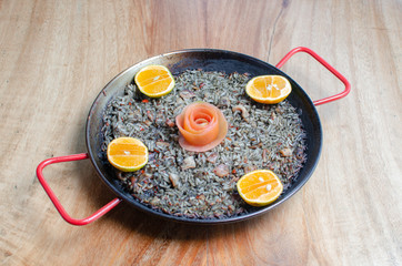 black paella, rice with squid - spanish cuisine